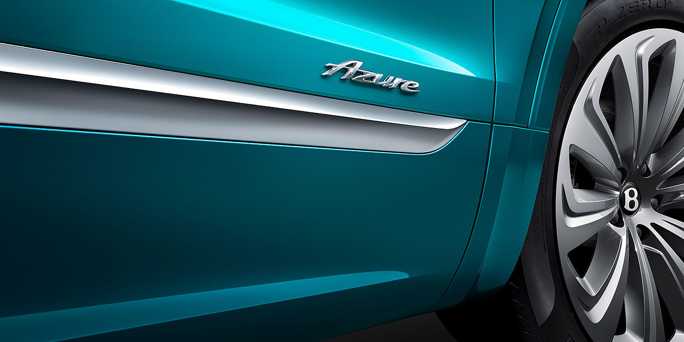 宾利无锡 Side skirt view of Bentley Bentayga Azure in Topaz blue with chrome accents and Azure emblem in focus with 22 " Ten Spoke Wheel.
